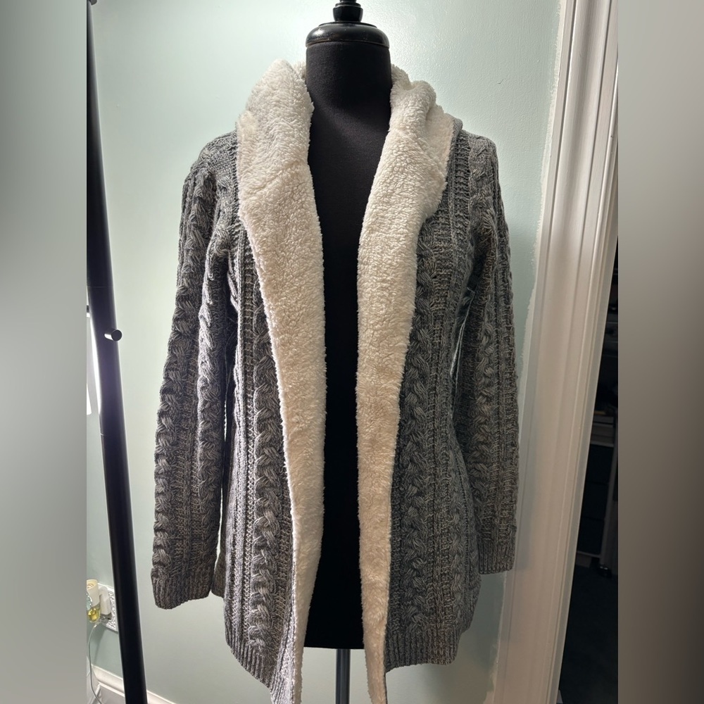 New open cardigan. Heathered in color, solid inside, side slits Sherpa Trim